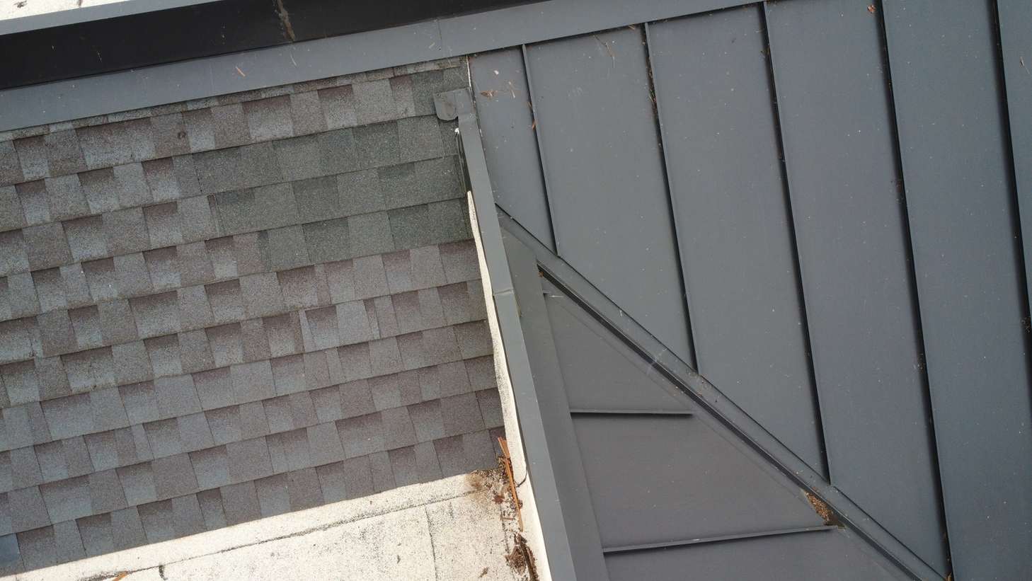 Shingle-to-standing-seam roof transition detail