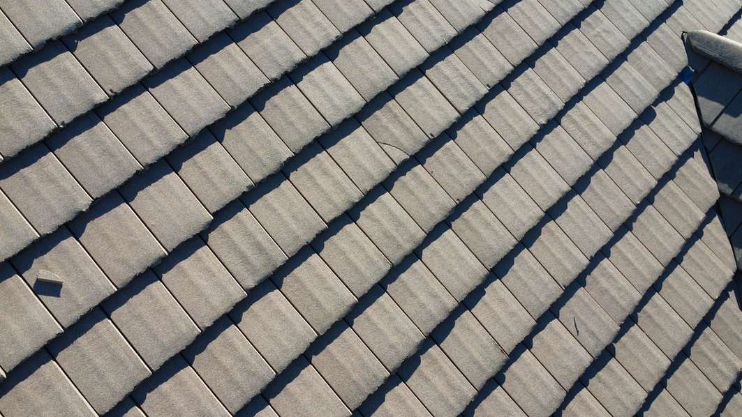 Gray roof tiles viewed from above