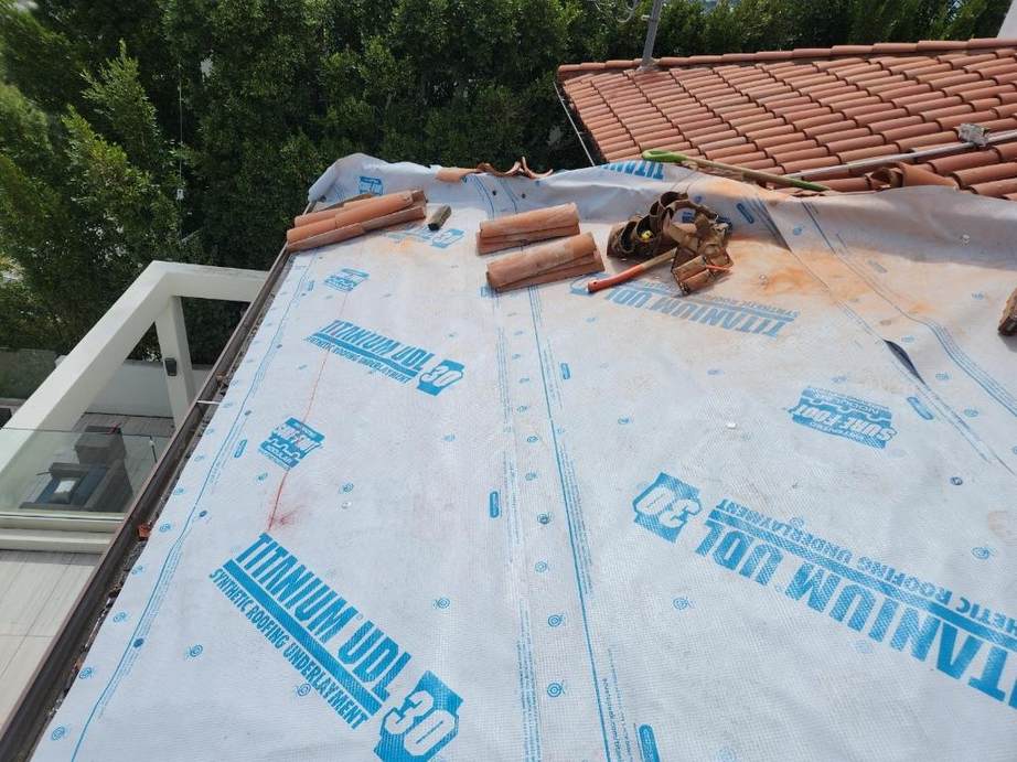 Underlayment, loose roof tiles and hand tools